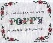 Cross stitch square for Poppy's quilt